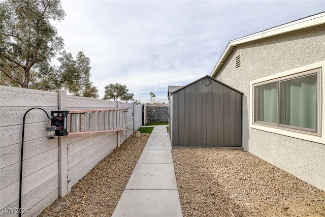 view of side of home with a storage unit