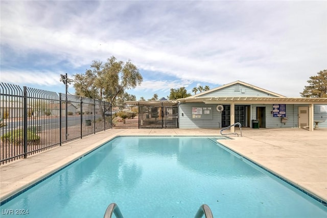 view of swimming pool with a patio