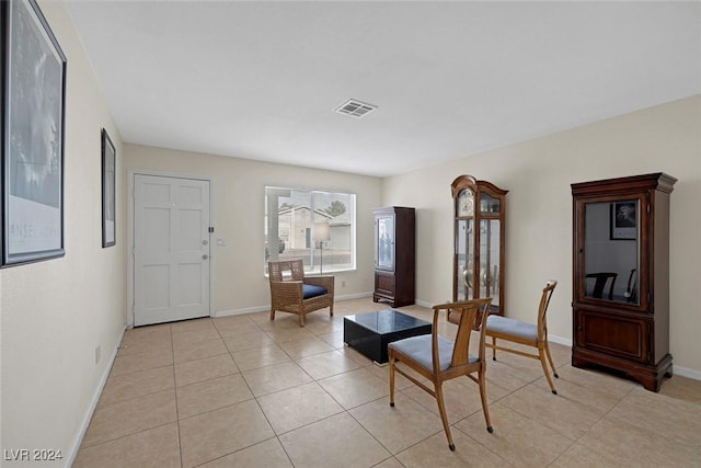 living area featuring light tile patterned flooring