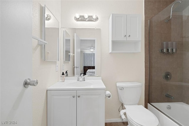 full bathroom with vanity, toilet, and enclosed tub / shower combo