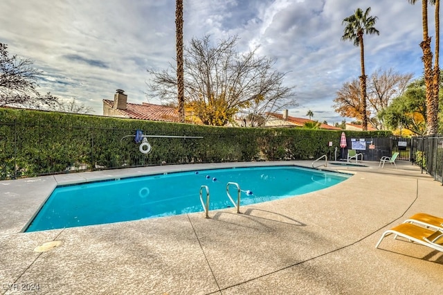 view of pool featuring a patio