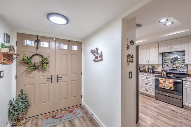 entrance foyer with light hardwood / wood-style floors