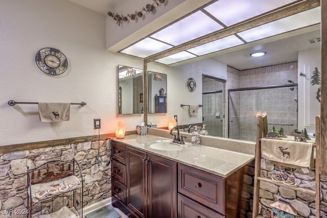 bathroom with vanity and an enclosed shower