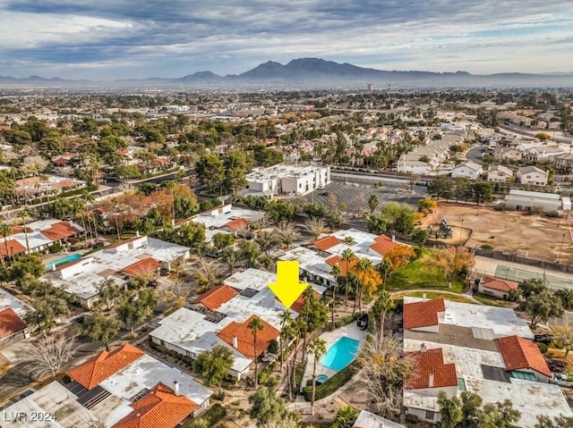 birds eye view of property with a mountain view