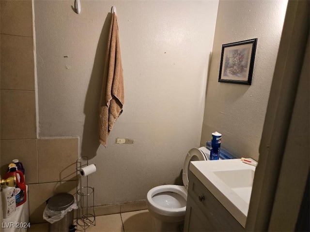 bathroom with tile patterned floors, vanity, and toilet