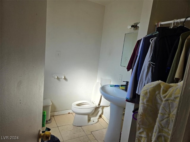 bathroom with tile patterned flooring and toilet