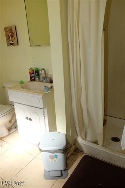 bathroom with toilet, tile patterned flooring, vanity, and a shower with shower curtain