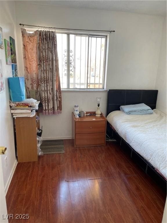 bedroom featuring dark hardwood / wood-style floors