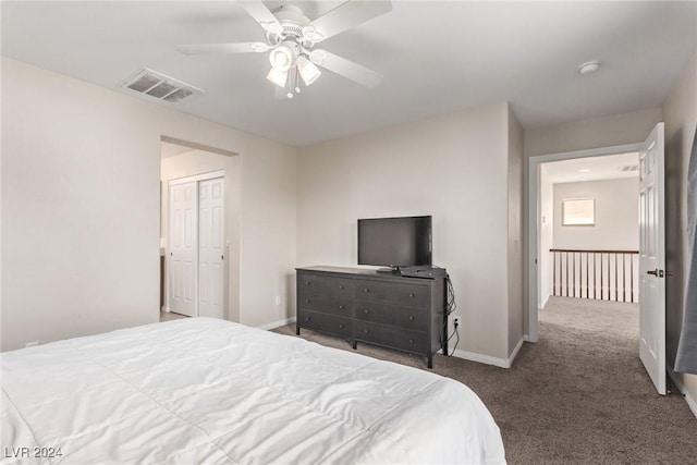 bedroom featuring ceiling fan, a closet, and carpet floors