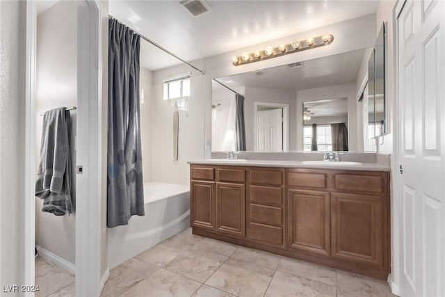 bathroom with plenty of natural light, ceiling fan, vanity, and shower / tub combo with curtain