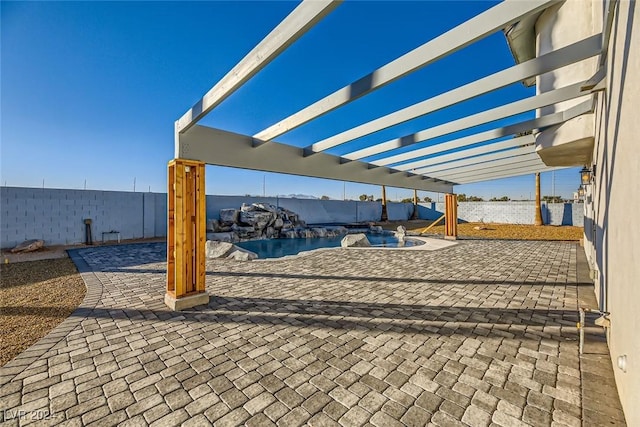 view of patio / terrace featuring a fenced in pool and a pergola