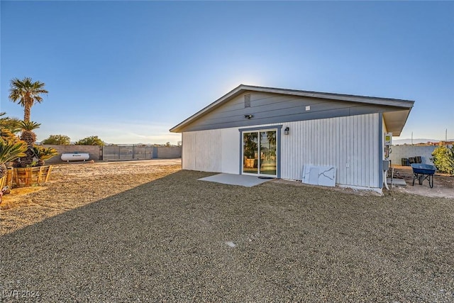 rear view of property featuring a patio area