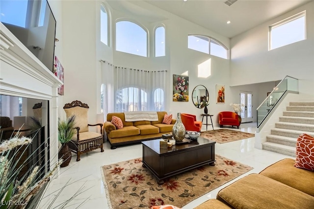 living room featuring a towering ceiling