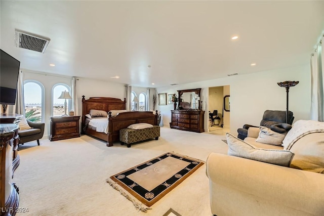 bedroom featuring light carpet