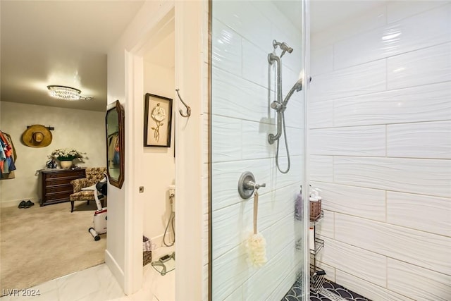 bathroom featuring tiled shower