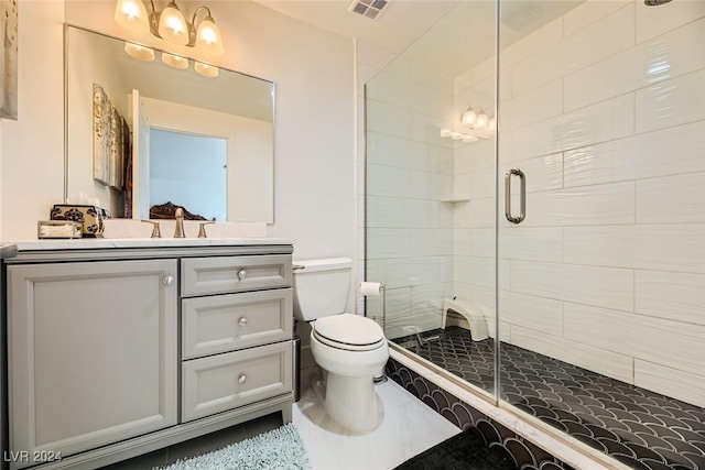 bathroom with toilet, vanity, and an enclosed shower