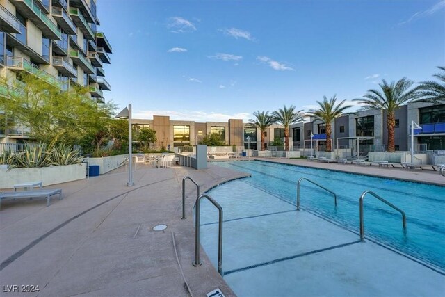 community pool with a patio area