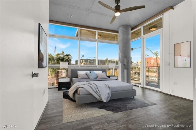 bedroom with floor to ceiling windows, access to outside, multiple windows, and wood finished floors