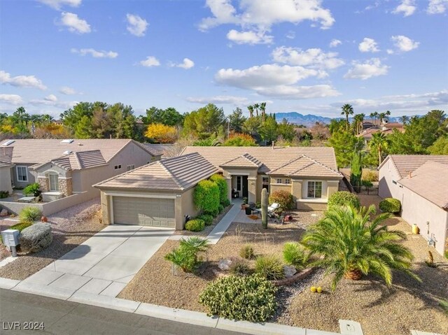 view of front of house with a mountain view and a garage