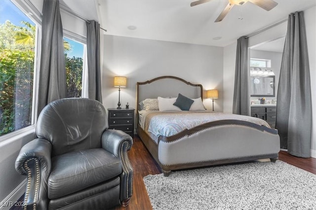 bedroom with multiple windows, dark wood-type flooring, and ceiling fan