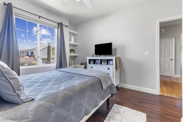 bedroom featuring ceiling fan and dark hardwood / wood-style flooring