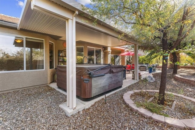 view of patio with a hot tub