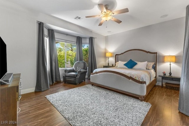 bedroom featuring dark wood-type flooring and ceiling fan