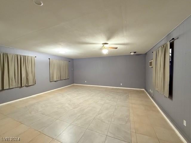 unfurnished room featuring baseboards