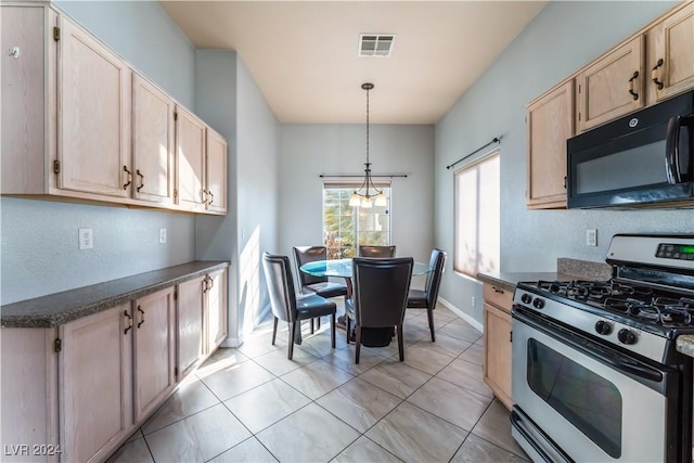 kitchen featuring decorative light fixtures, stainless steel gas range oven, light tile patterned floors, and light brown cabinetry