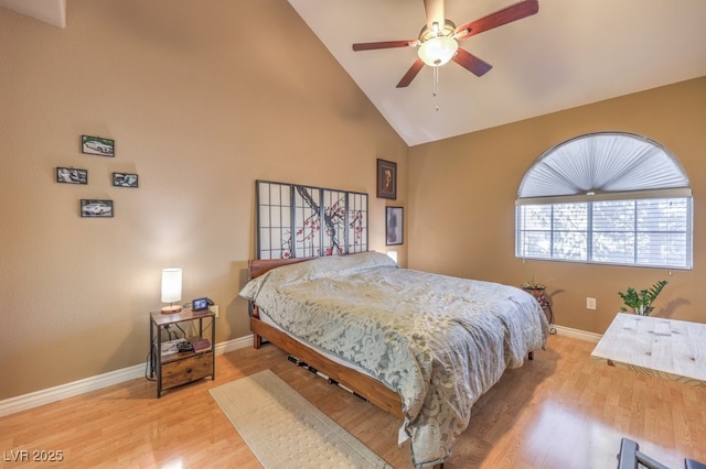 bedroom featuring vaulted ceiling, light wood-type flooring, and ceiling fan