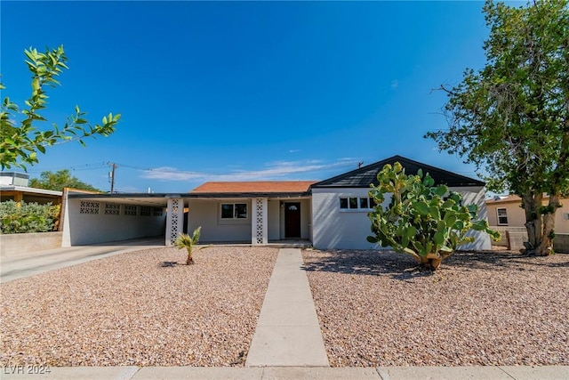 ranch-style house with a carport