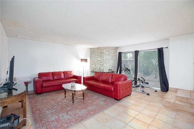 living room with light tile patterned floors and a textured ceiling