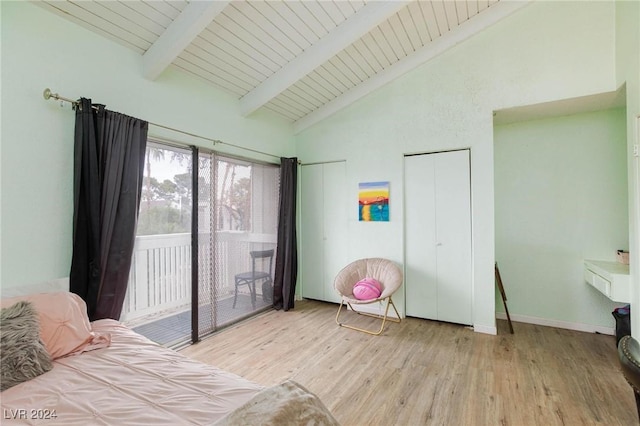 bedroom with access to outside, vaulted ceiling with beams, wood ceiling, and light hardwood / wood-style floors