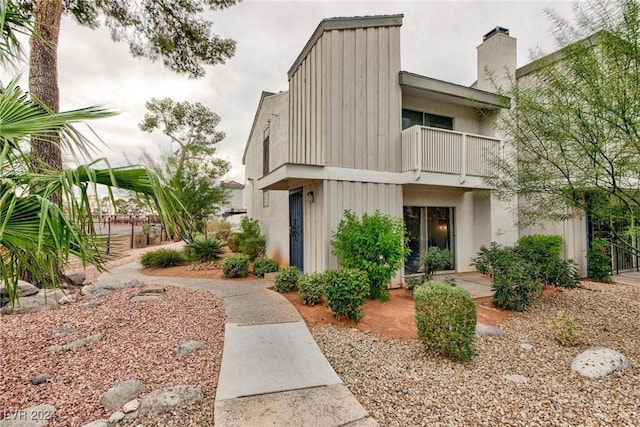 view of front of property with a balcony