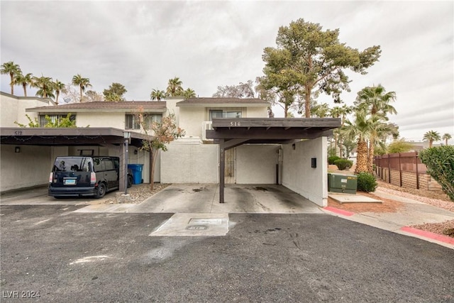 exterior space with a carport