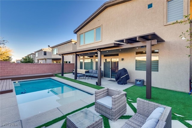 view of swimming pool with an outdoor living space, grilling area, and a patio area