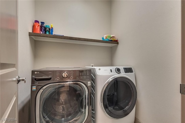 laundry room with independent washer and dryer