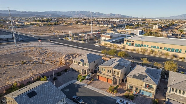 birds eye view of property featuring a mountain view