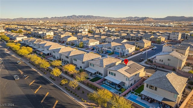 birds eye view of property with a mountain view