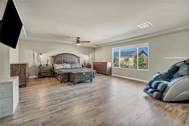 bedroom with light wood-type flooring and ceiling fan