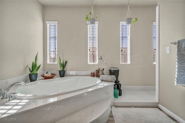 bathroom with tiled bath