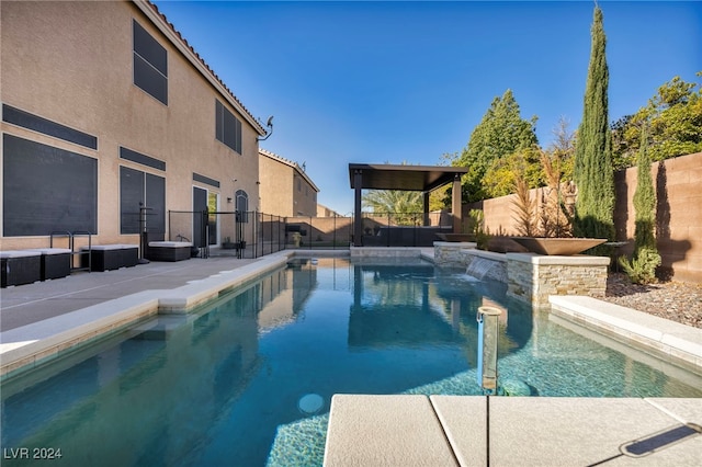 view of swimming pool featuring a patio area and pool water feature