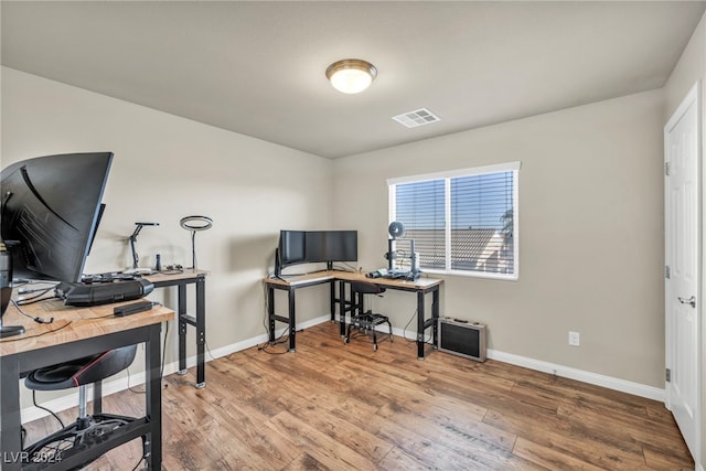 home office featuring hardwood / wood-style flooring