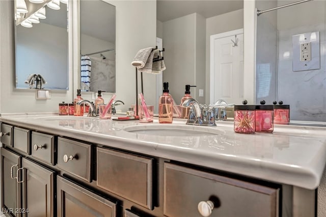 bathroom with a shower with shower curtain and vanity