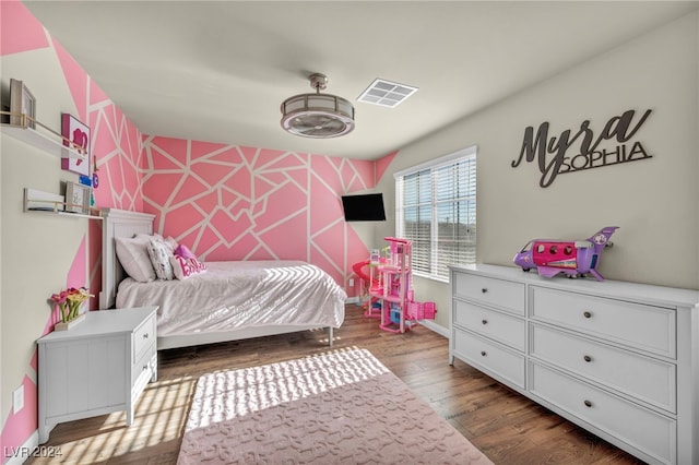 bedroom with dark wood-type flooring