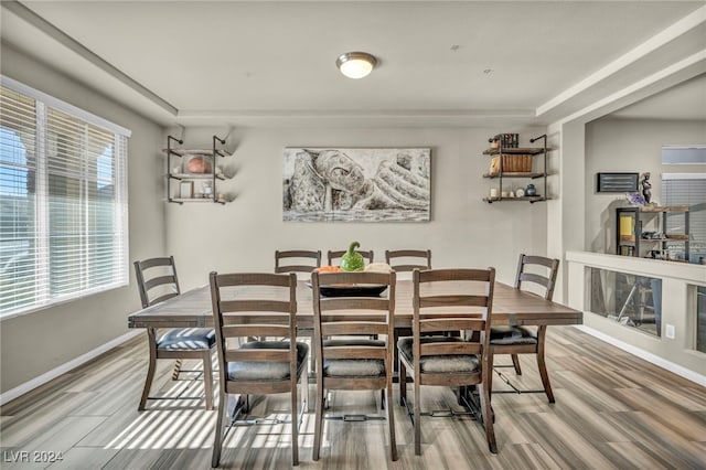 dining space with hardwood / wood-style flooring