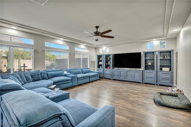 living room featuring ceiling fan and hardwood / wood-style flooring