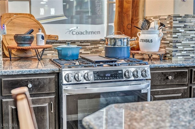 kitchen with backsplash and high end range