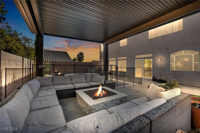 patio terrace at dusk with an outdoor fire pit