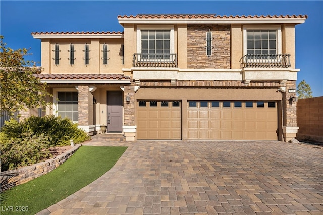 mediterranean / spanish-style home with a garage